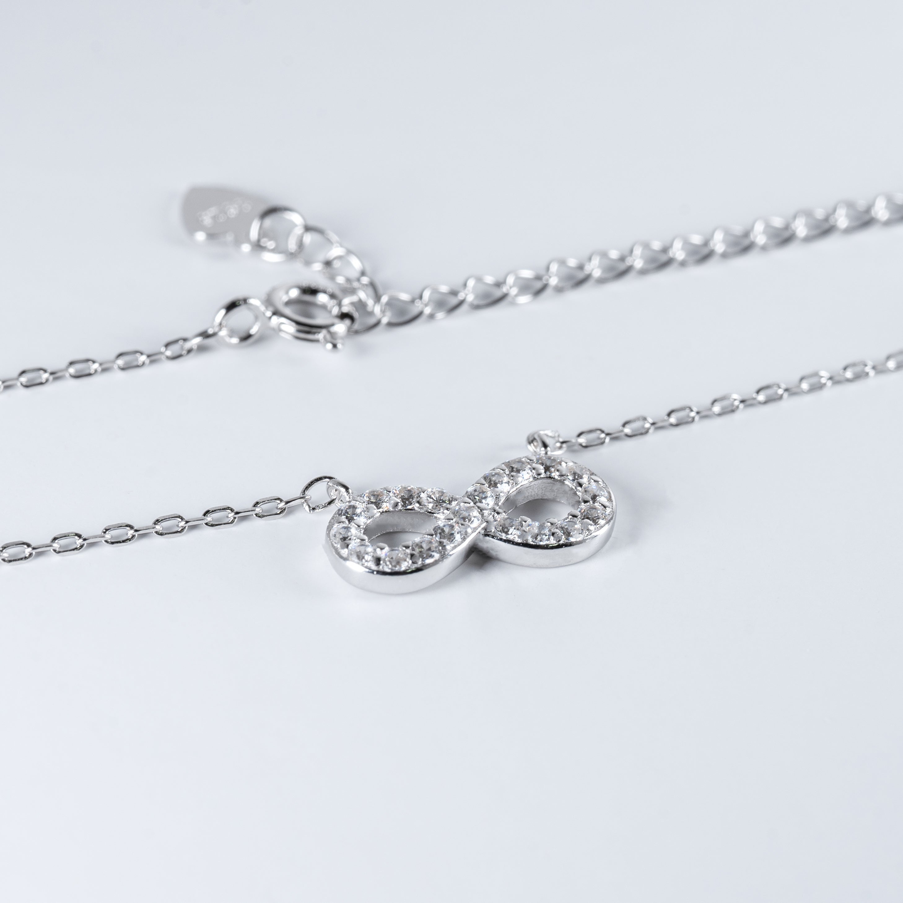 Sparkling Infinity Pendant Necklace in Sterling Silver and Cubic Zirconia